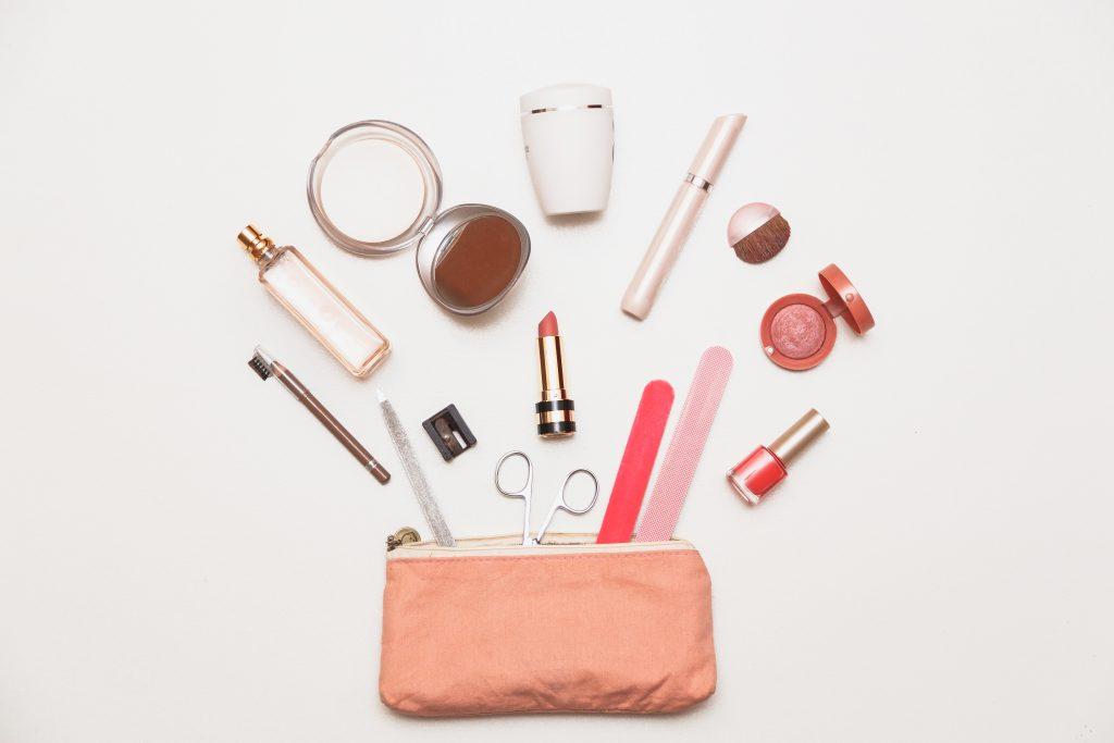 The contents of women's handbags. Make up bag with cosmetics.