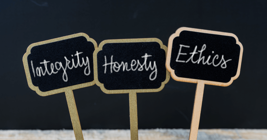 Placards that have Integrity, Honesty and Ethics written on it. Things you need to know before you turn 30