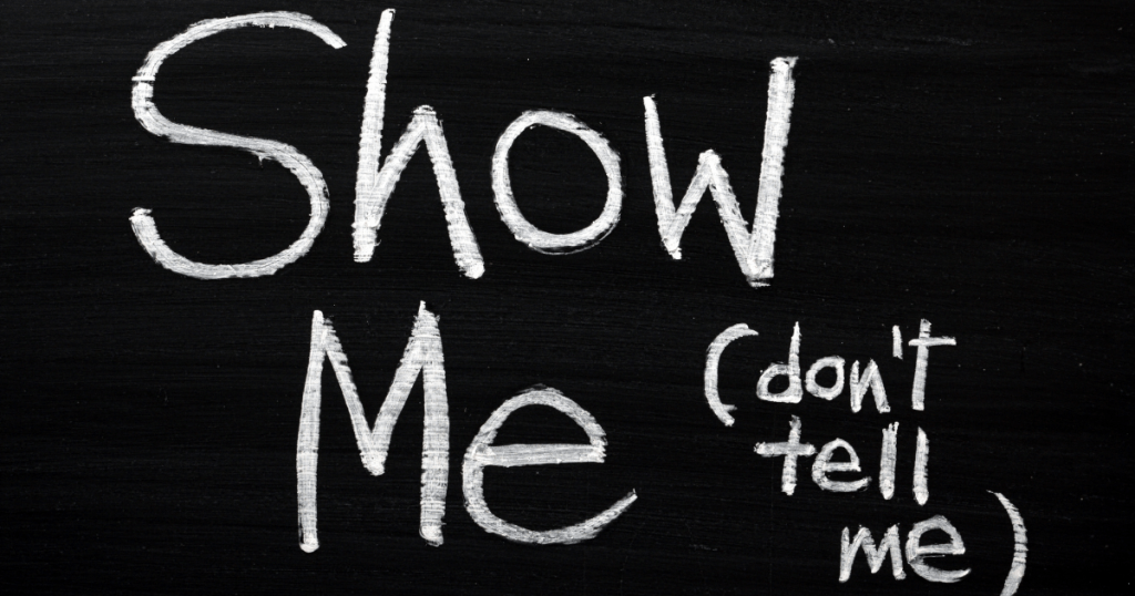 Text written on a black board saying: Show me, don't tell me. Tips to become a screenplay writer.