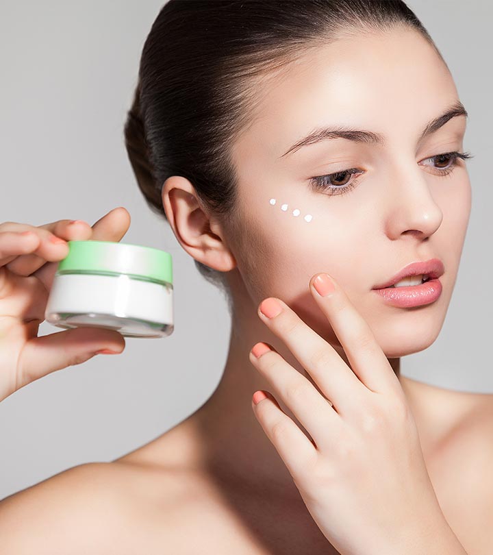 Girl is applying moisturizer over skin to maintain healthy skin
